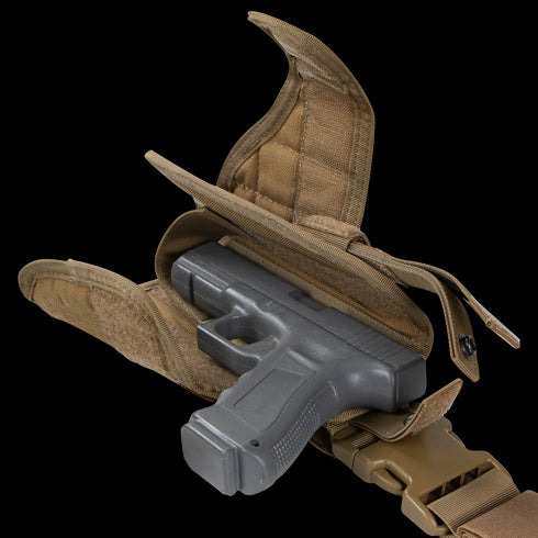 A Condor Tornado Tactical Leg Holster - Left Hand in tan, shown with its flap open and strap retention system securing a partially inserted black handgun.
