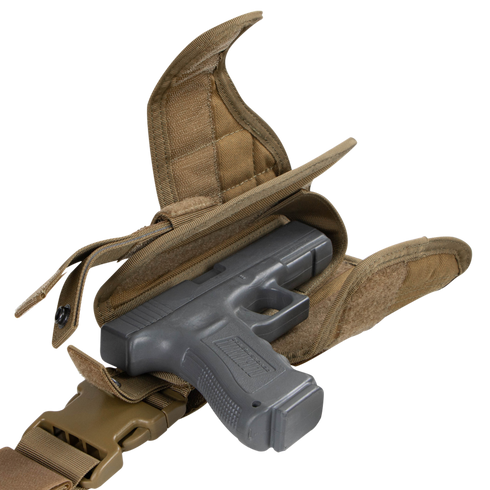 A Condor Tornado Tactical Leg Holster in tan fabric with Velcro flaps secures a black handgun and attaches to a matching belt with a plastic buckle.