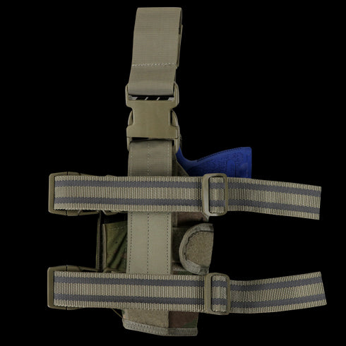 The Condor Tornado Tactical Leg Holster in MultiCam features adjustable straps and includes a visible blue training gun inserted in the holster.
