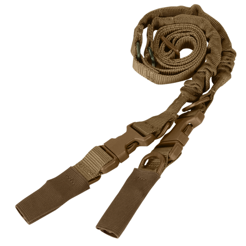 The Condor CBT 2-Point Bungee Sling, a tan adjustable rifle sling with quick-release buckles and reinforced loops, is coiled on a flat surface.