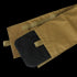 A close-up of the Condor Cyclone Plate Carrier in MultiCam shows a tan fabric sleeve with a hook-and-loop closure, partially revealing a black rectangular plate—perfect for military or first responder use.