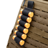 The Condor TSRS Shotshell Strip is a black elastic holder attached to a tactical vest, holding six orange shotgun shells.