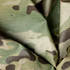 Close-up of the Condor Raincover 40L - MultiCam, showing its green, brown, and beige camouflage pattern with a visible grid texture.