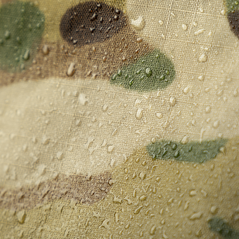 Close-up of water droplets on the Condor Raincover 40L - MultiCam, highlighting the fabric's camouflage pattern, texture, and waterproof qualities.