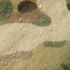 Close-up of water droplets on the Condor Raincover 40L - MultiCam, highlighting the fabric's camouflage pattern, texture, and waterproof qualities.