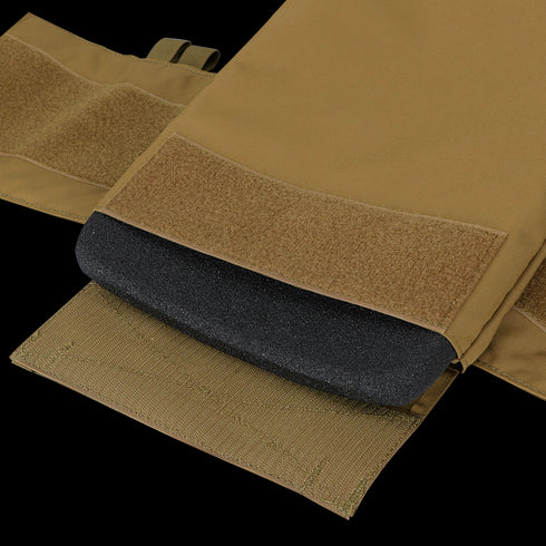 Close-up of the Condor Cyclone RS Plate Carrier in MultiCam Black, showing a tan pocket with hook-and-loop closure and a black foam pad inside—ideal for everyday carry or range essentials.