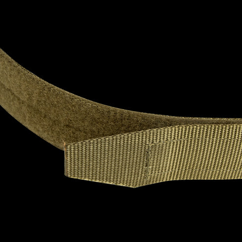 Close-up of the Condor Hybrid EDC Belt in tan or olive green with a hook-and-loop fastener, designed for tactical, military, or law enforcement use, displayed against a matching vertically striped background.