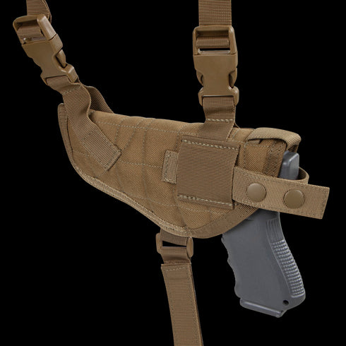 The Condor Universal Shoulder Holster in tan features adjustable straps, secure snap closures, and holds a black pistol securely.