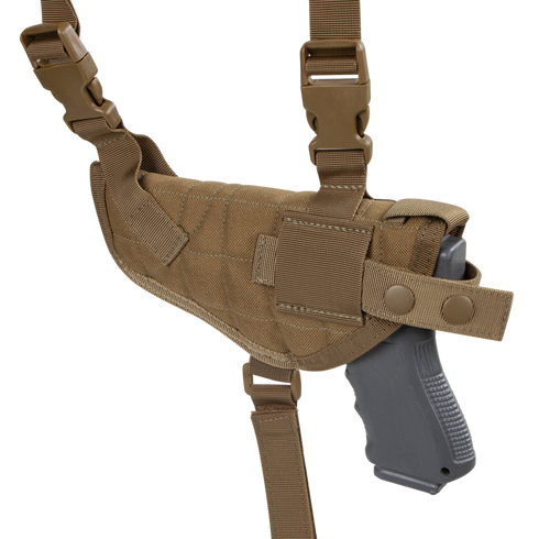 The Condor Universal Shoulder Holster in tan features adjustable straps, secure snap closures, and holds a black pistol securely.