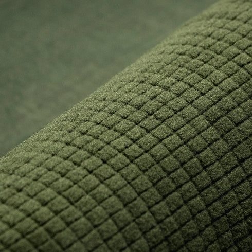 Close-up of olive green fabric with a raised, grid-like texture on the Condor Base II Mid-Weight Drawer, ideal for tactical gear used by law enforcement and first responders.
