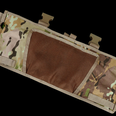 The Condor Rapid Assault Chest Rig in Scorpion OCP features a camouflage pattern, brown mesh pocket, and three tan plastic buckle fasteners—designed for military or tactical use.