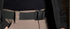 Close-up of a person wearing tan pants, a black Condor PDQ Magnetic Belt with a plastic buckle (on sale), and a black jacket.