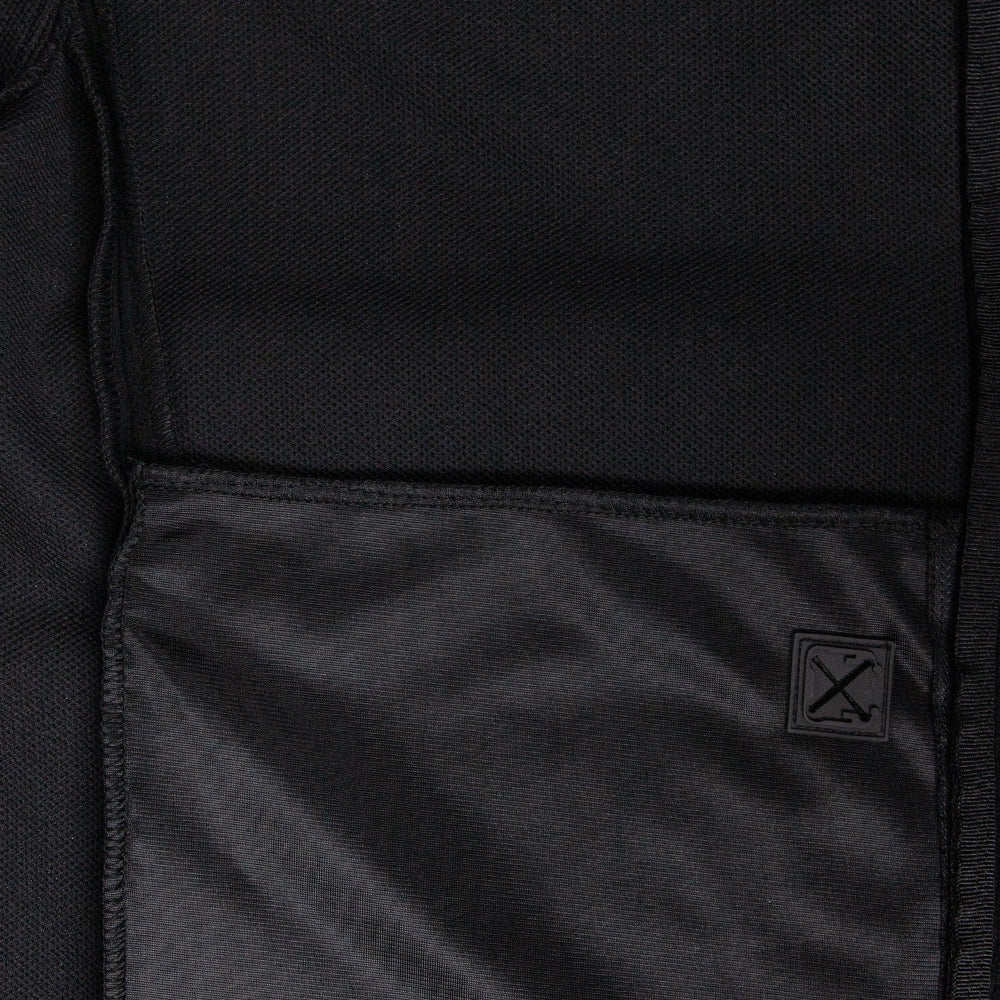 Close-up of the Condor Bravo Fleece Jacket’s black fabric pocket with a small patch featuring two crossed tools stitched on the lower right corner—ideal for EDC or First Responders.