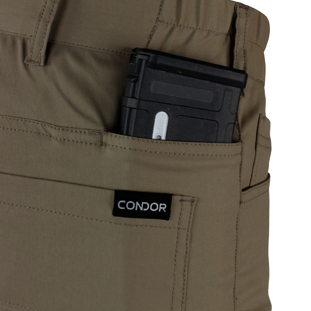 A black magazine is partially visible in the front pocket of tan Condor Cipher Pants—perfect for EDC or law enforcement use.