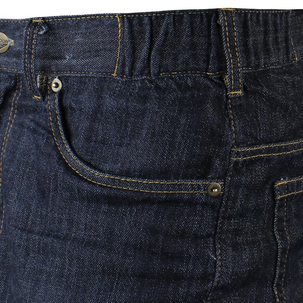 Close-up of the front pocket and waistband of Condor Cipher Jeans, featuring dark blue tactical denim with visible stitching and metal rivets.