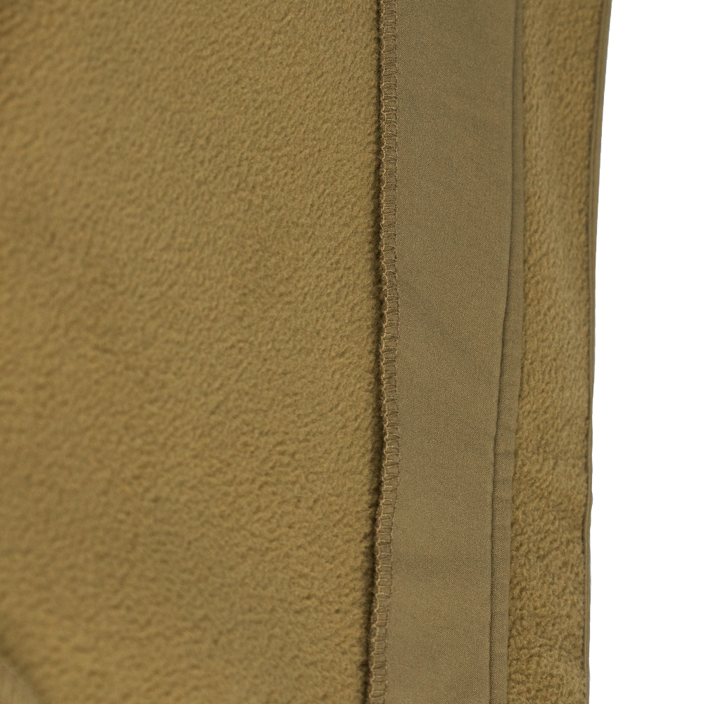 Close-up of the tan fleece fabric and vertical seam on the Condor Westpac Softshell Jacket, commonly used in Military and First Responder apparel.