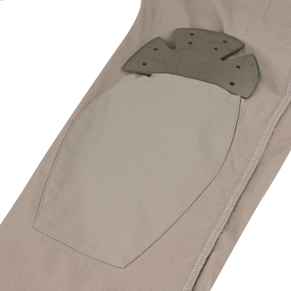 A close-up of Condors Patrol ADF Pants in tan shows an external pocket with a removable, textured knee pad insert—perfect for military or law enforcement professionals needing comfort and protection.