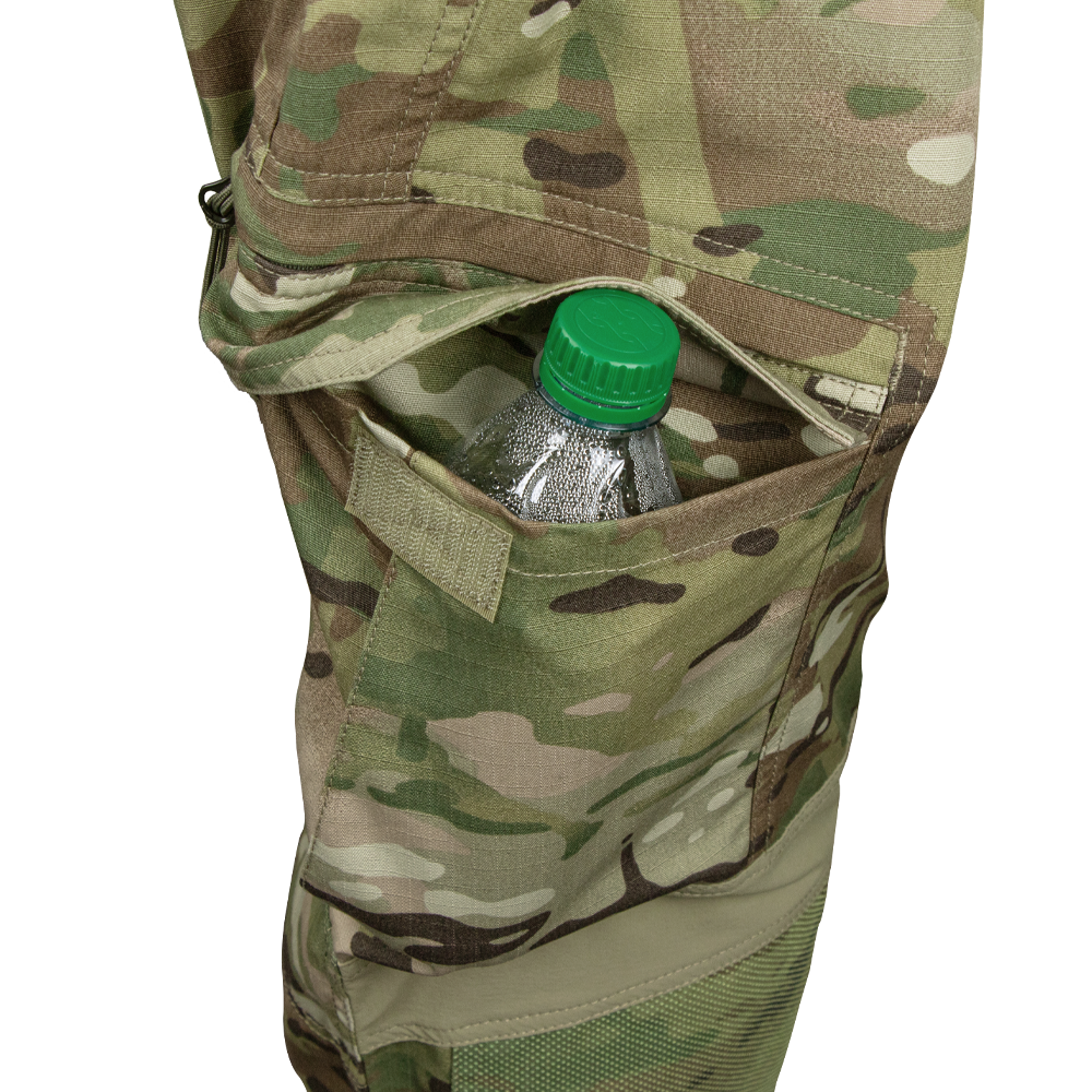 A clear plastic water bottle with a green cap is partially visible in the side pocket of Condors Paladin Tactical Pants in MultiCam.
