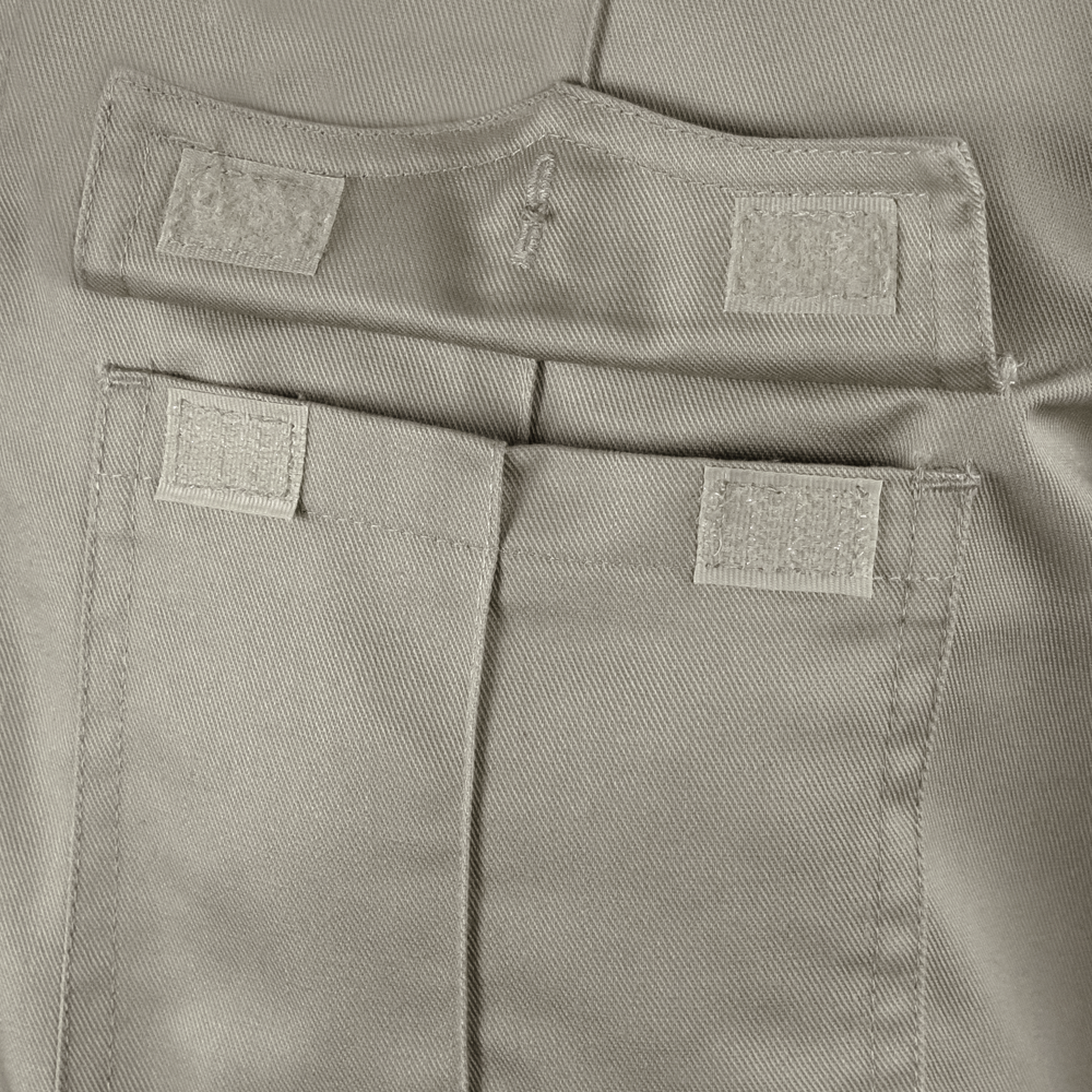 Close-up of a beige tactical fabric pocket with two Velcro fasteners and a stitched flap on the Condor Mens Class B Uniform Shirt | SALE.