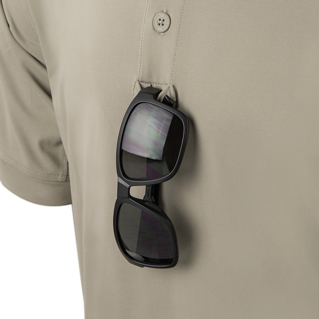 A pair of black sunglasses hangs from the button placket of a beige Condor Short Sleeve Dri-Flex Tactical Polo.