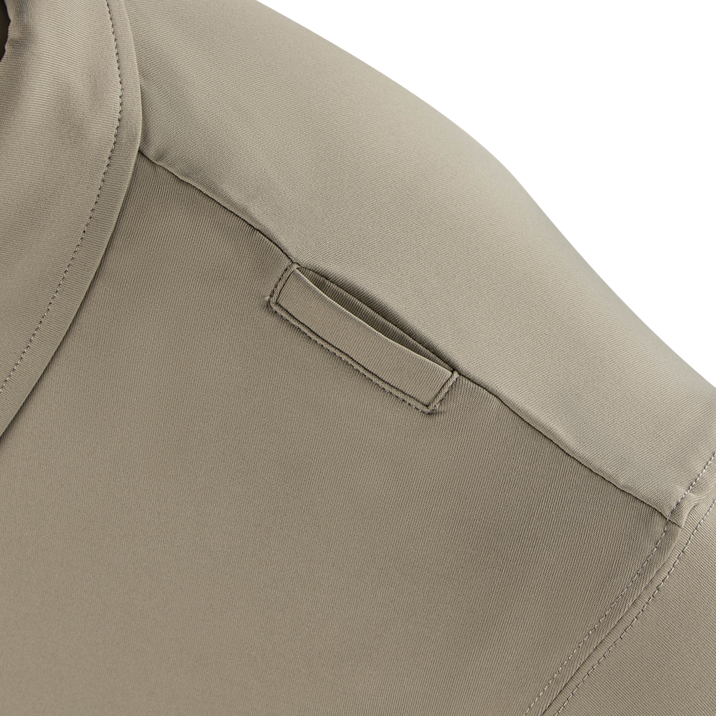 Close-up of the Condor Short Sleeve Dri-Flex Tactical Polo in khaki, highlighting the shoulder epaulet detail with a fabric loop.