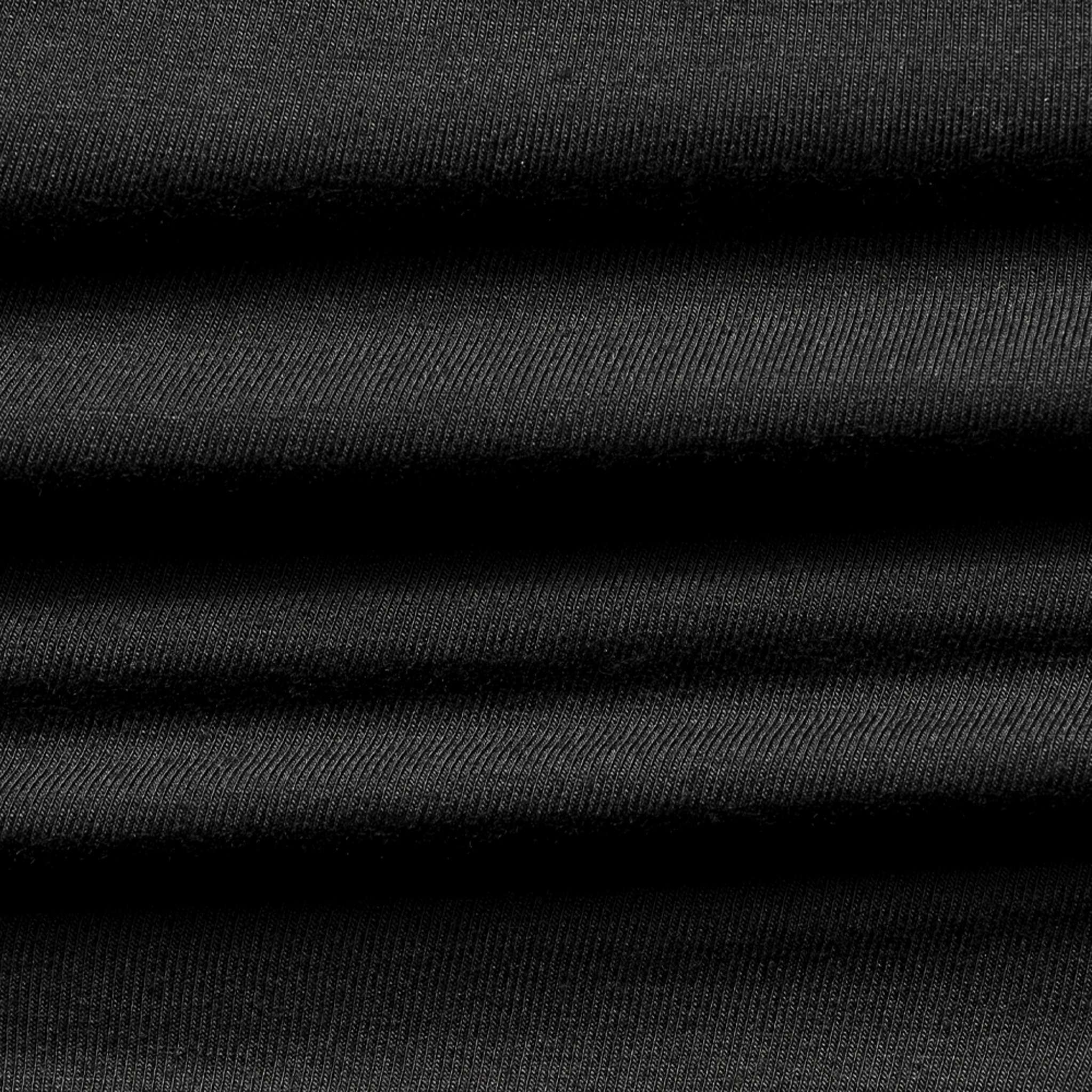 Close-up of the Condor Trident Sun Shirt's black, ribbed fabric, featuring horizontal folds that create a textured pattern.