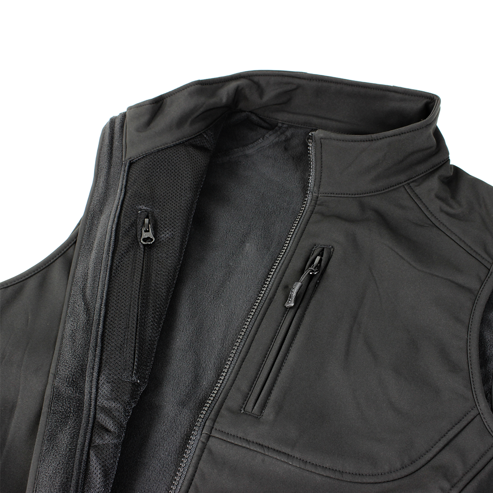A close-up of the Condor Core Softshell Vest in black, ideal for EDC, shows its zippered chest pocket and partially opened main zipper.