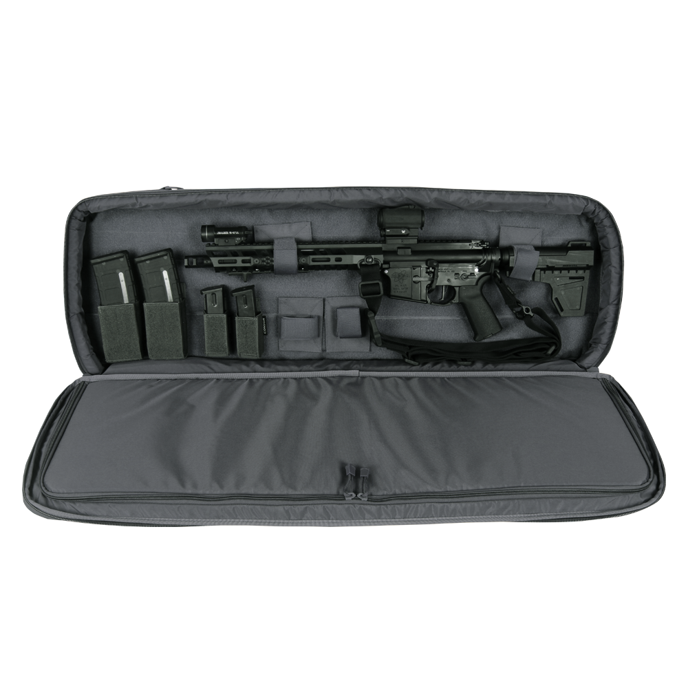 A black rifle with scope and magazines is stored in the Condor 36