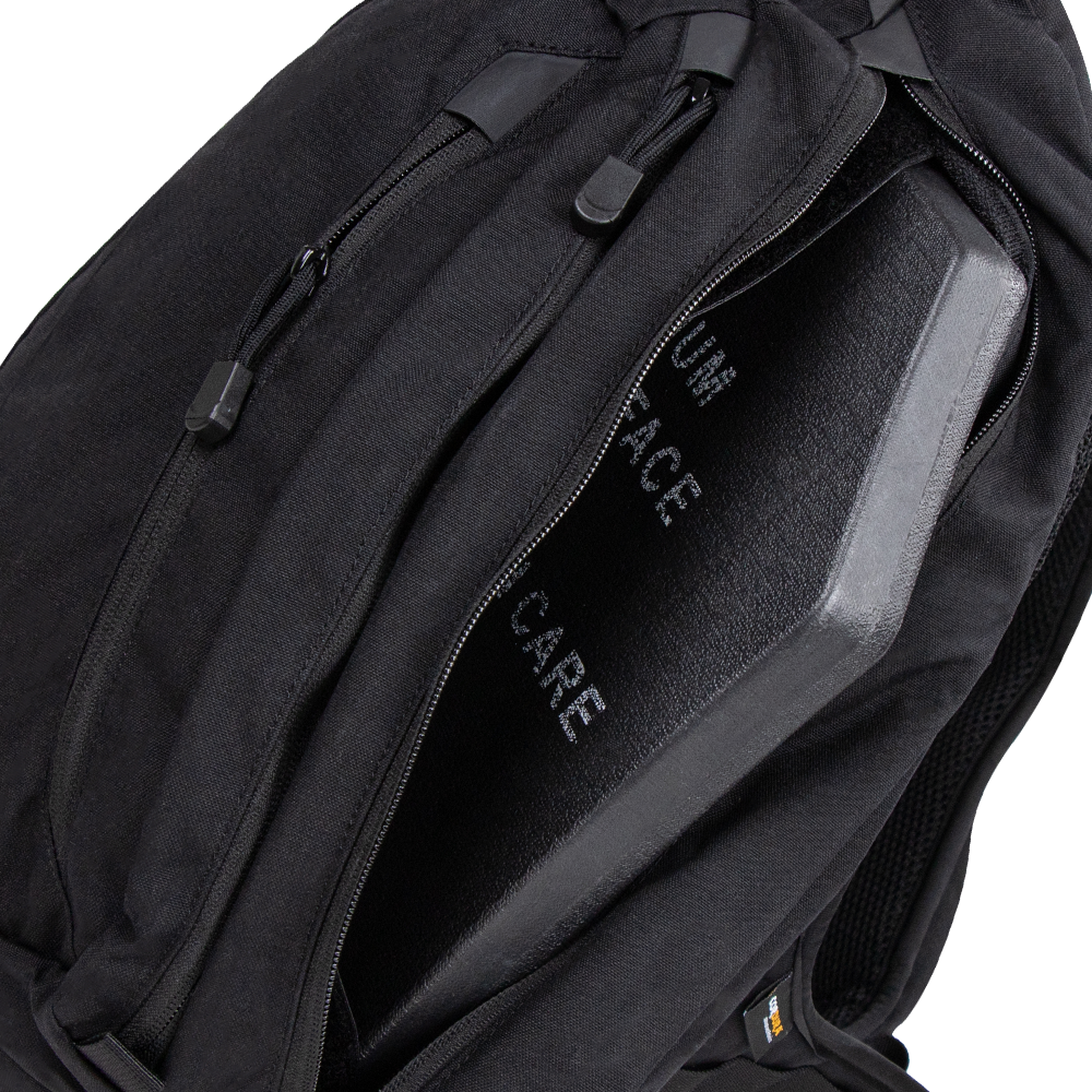 A Condor Elite Sector Sling Bag 18L in black is shown with a partially open zipper, revealing a protective ballistic plate inside.