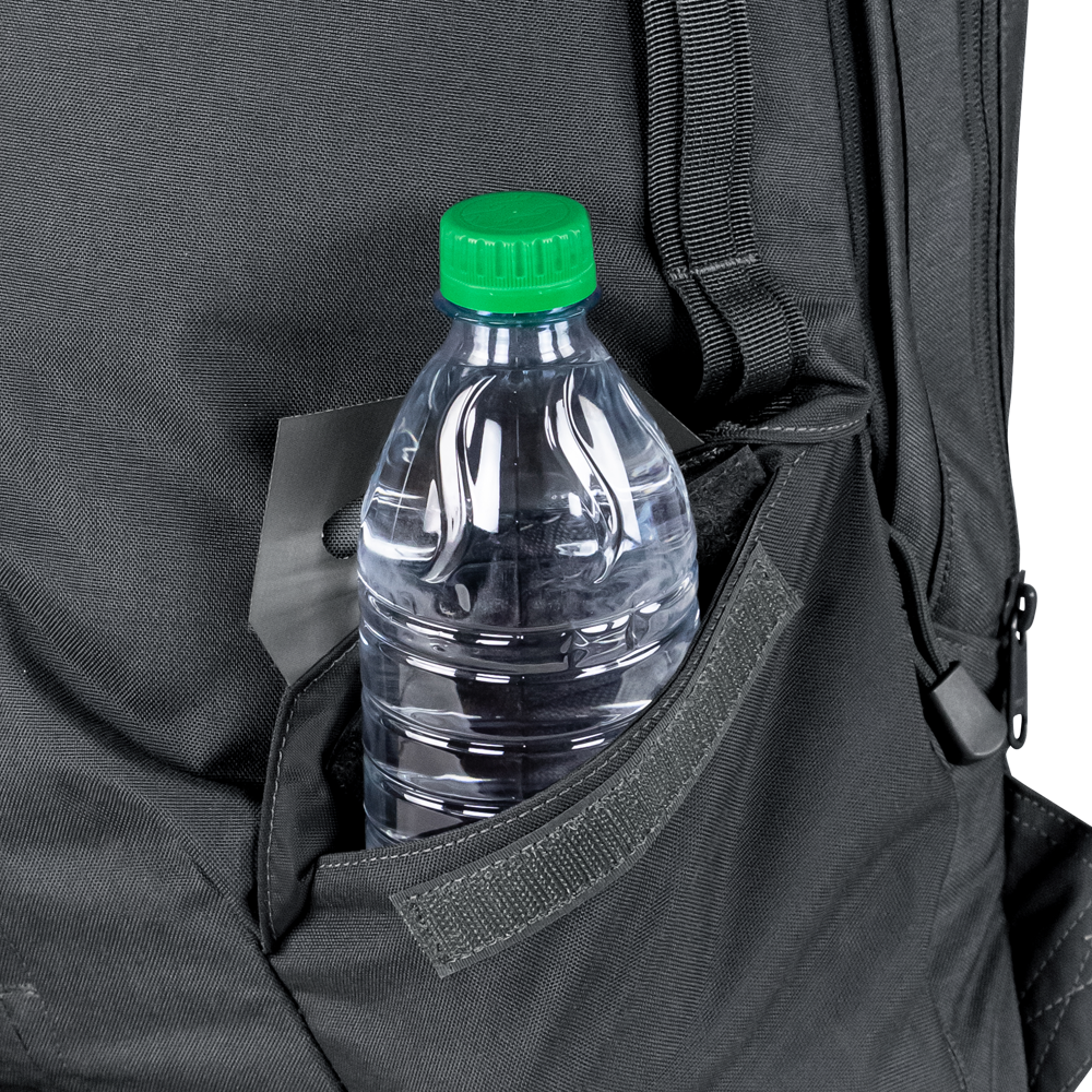 A clear plastic water bottle with a green cap sits in the side pocket of the Condor Elite Fail Safe Urban Backpack Gen II 18L by Condor, ready for a shooting range session or an outdoor bushcraft adventure.