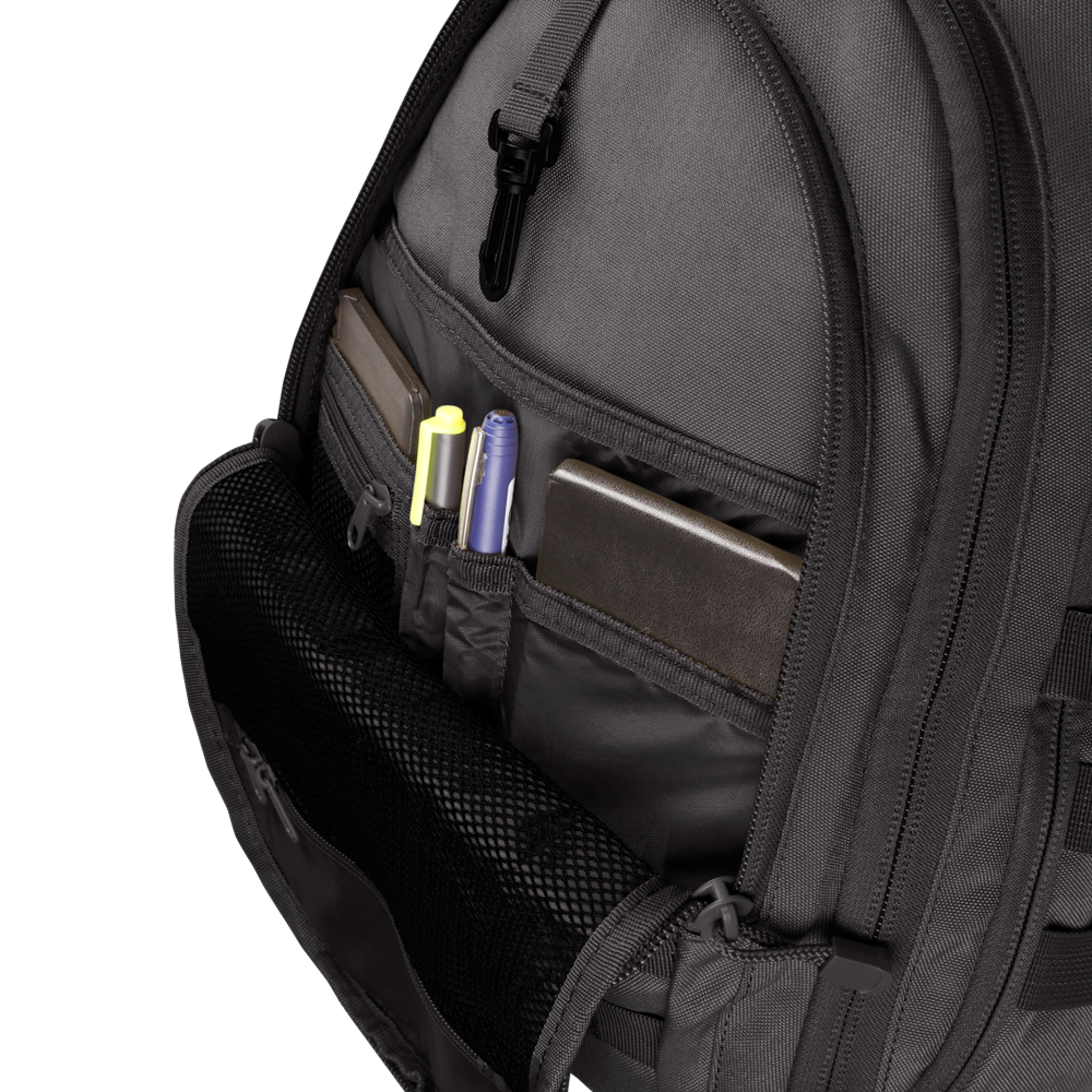 The Condor Ambidextrous Sling 27L in gray features an open front pocket displaying organized compartments for pens, a notebook, and a closed laptop.