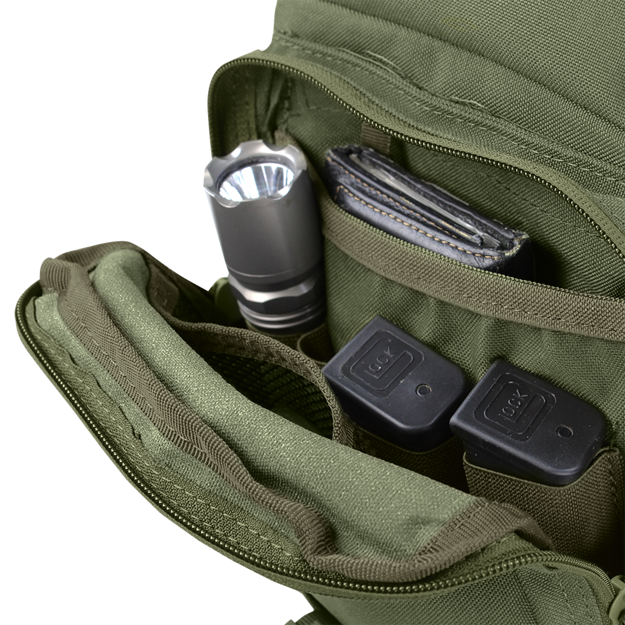 A Condor EDC Bag | SALE with an open green pocket holds a flashlight, wallet, and two Glock pistol magazines neatly organized in separate compartments.