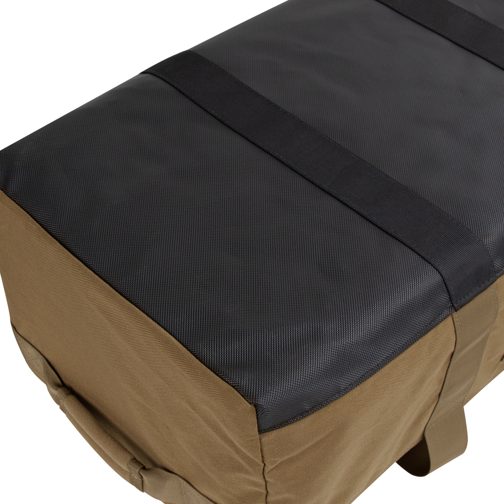 A close-up view of the Condor Colossus Duffle Bag 60L, featuring a rectangular shape, black top, brown sides, and two black straps running across the top.