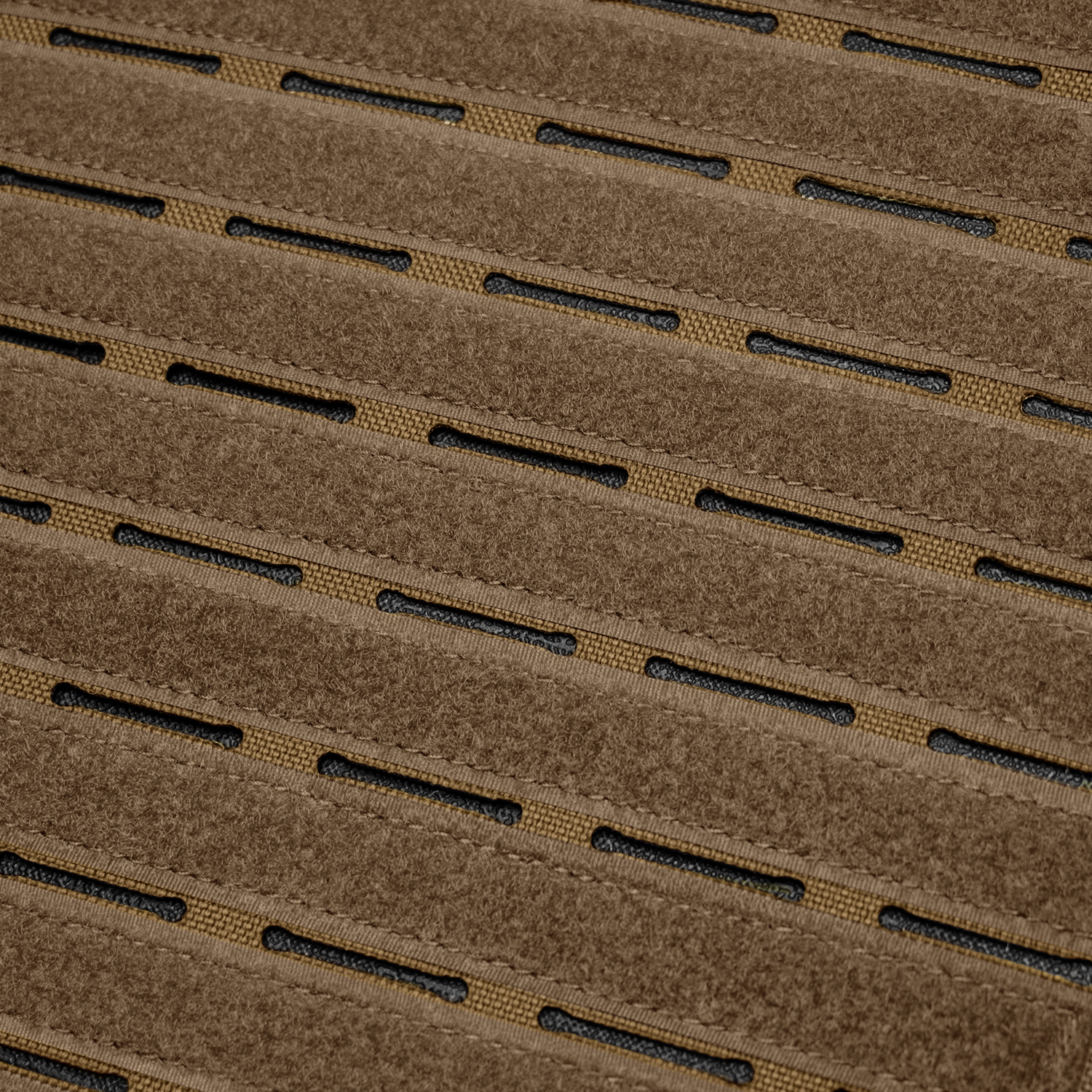 Close-up of the Condor Elite LCS Vanquish Plate Carrier by Condor, featuring brown tactical fabric with evenly spaced horizontal slits and a black mesh layer underneath.