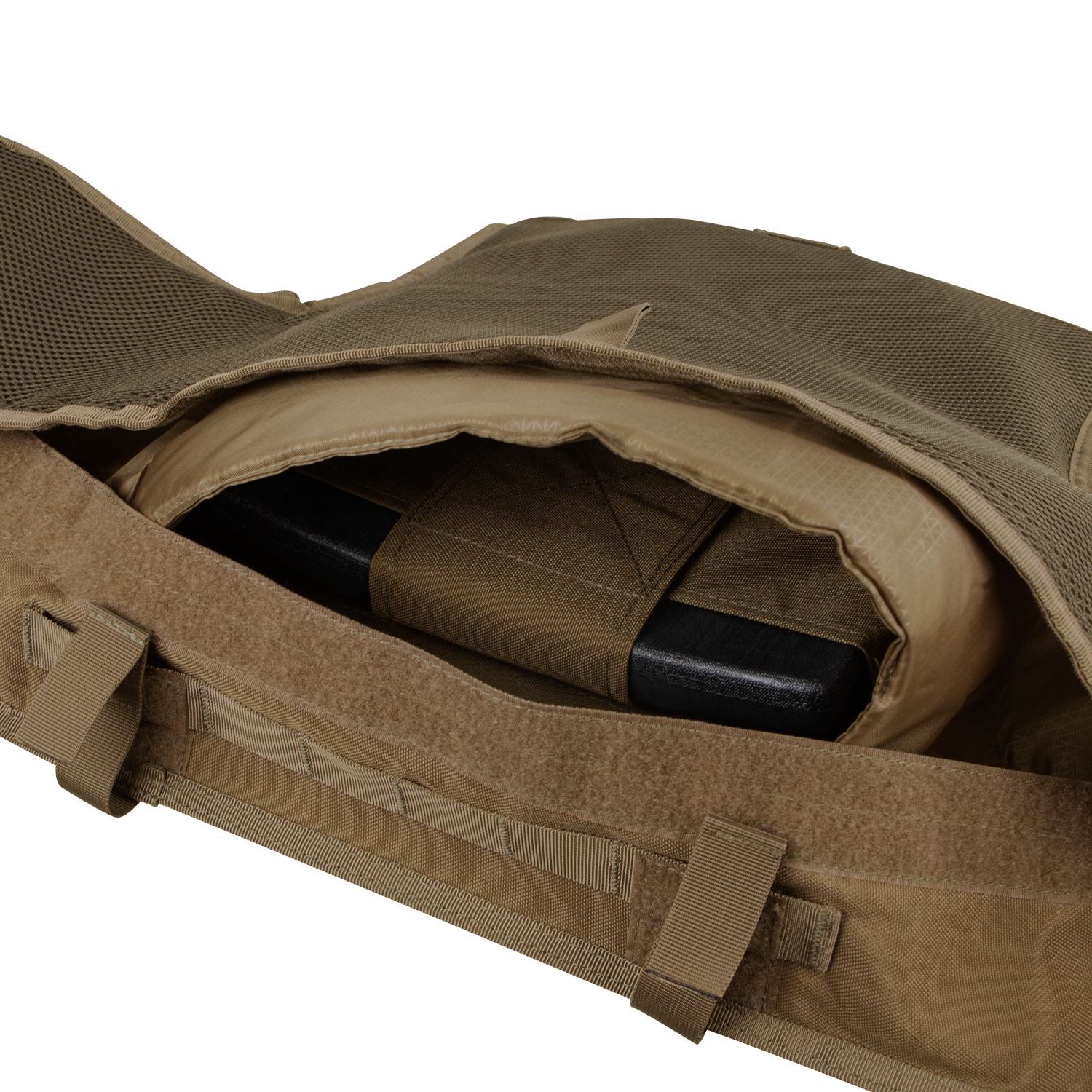 A close-up of the Condor Enforcer Releasable Plate Carrier in tan shows its open pocket with a black ballistic plate inside—an essential EDC gear choice for first responders.