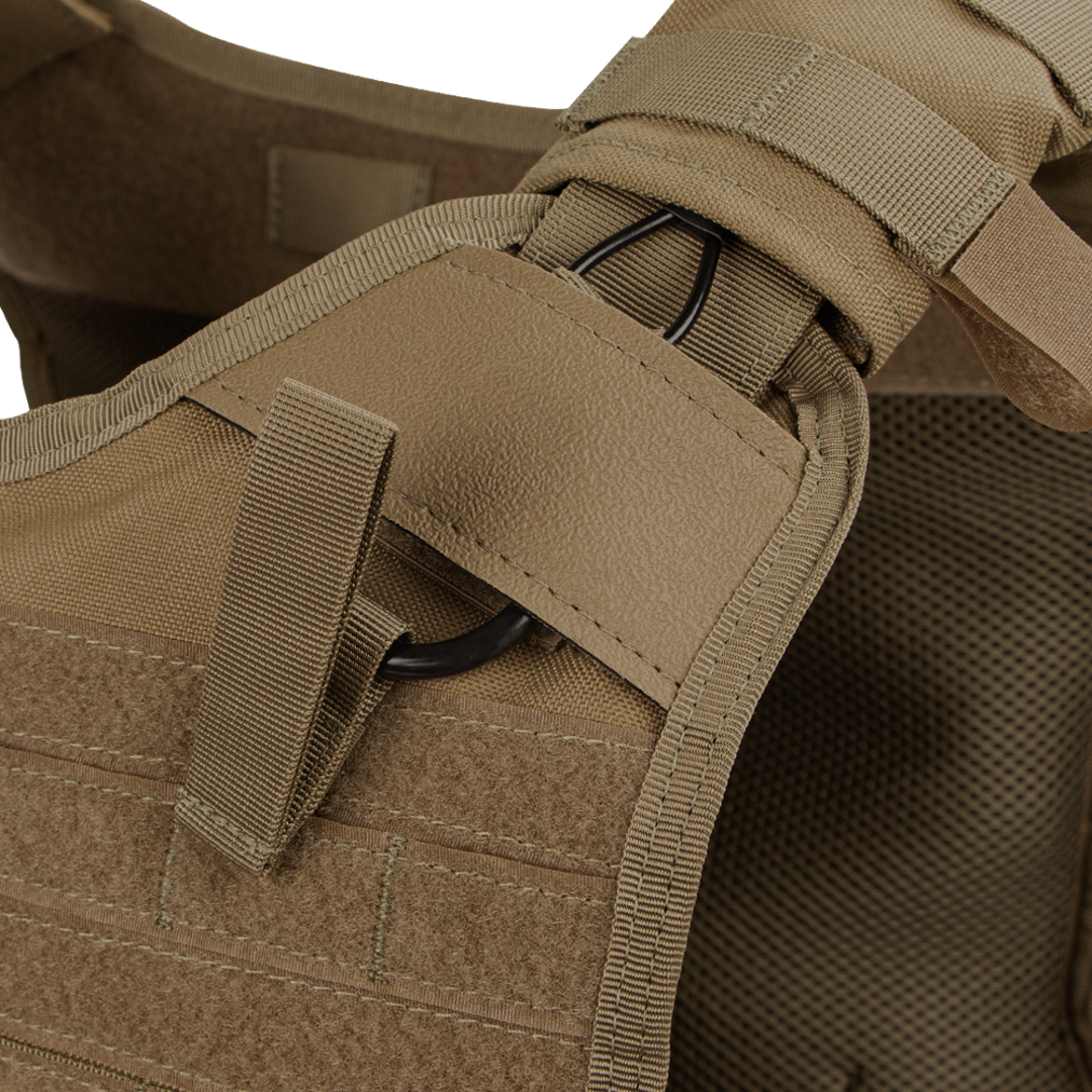 Close-up of the Condor Enforcer Releasable Plate Carrier shoulder strap (tan), showcasing MOLLE webbing, Velcro, and a black metal ring.