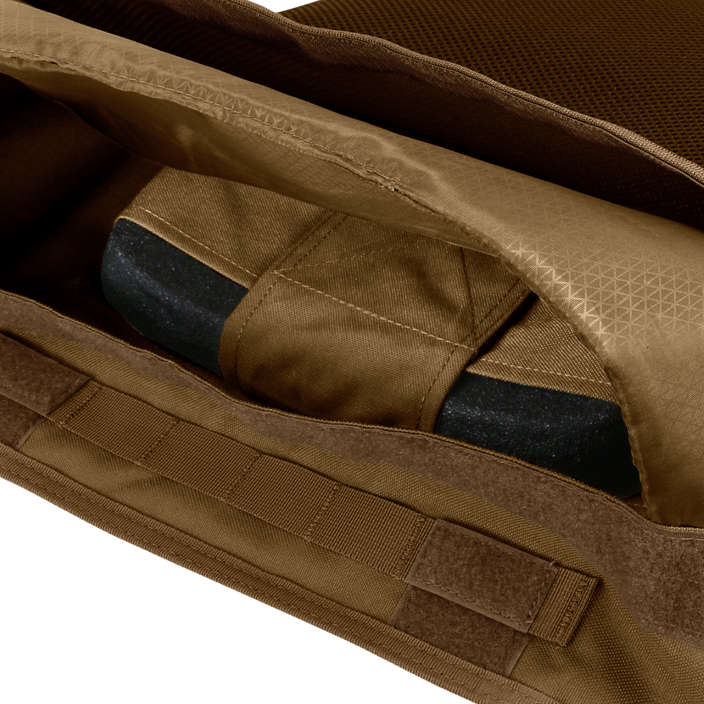 A close-up view of the Condor EXO Plate Carrier Gen II in brown fabric with an open zipper, showing a partially enclosed black object inside.