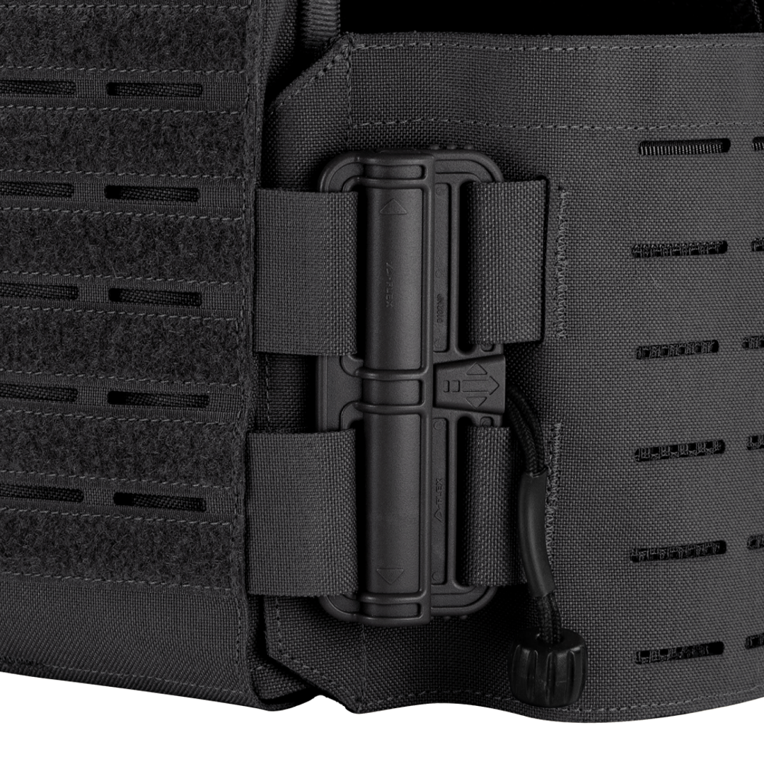 Close-up of the Condor Vanquish RS Plate Carrier in black, featuring a secured radio attached to the side with nylon straps and a cord.