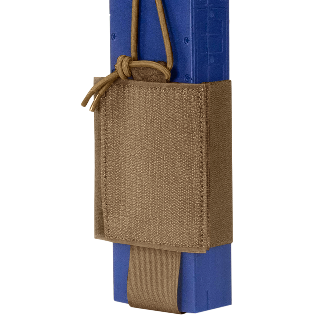 The Condor VAS Wing Pouch, made from tan tactical nylon, securely holds a blue training magazine with an adjustable cord—ideal for military or first responders.