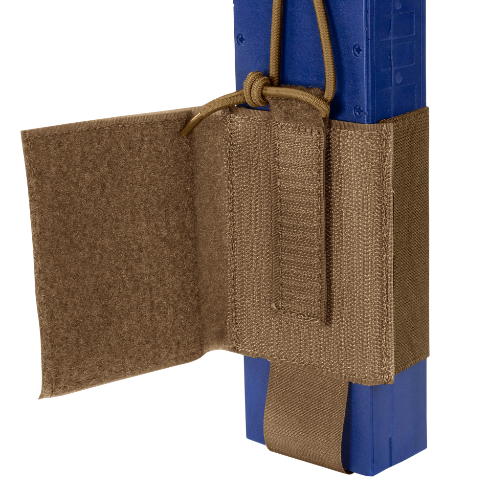 A close-up of the Condor VAS Wing Pouch in tan, designed for EDC or bushcraft, securely holds a blue rectangular object with adjustable straps and a hook-and-loop flap.