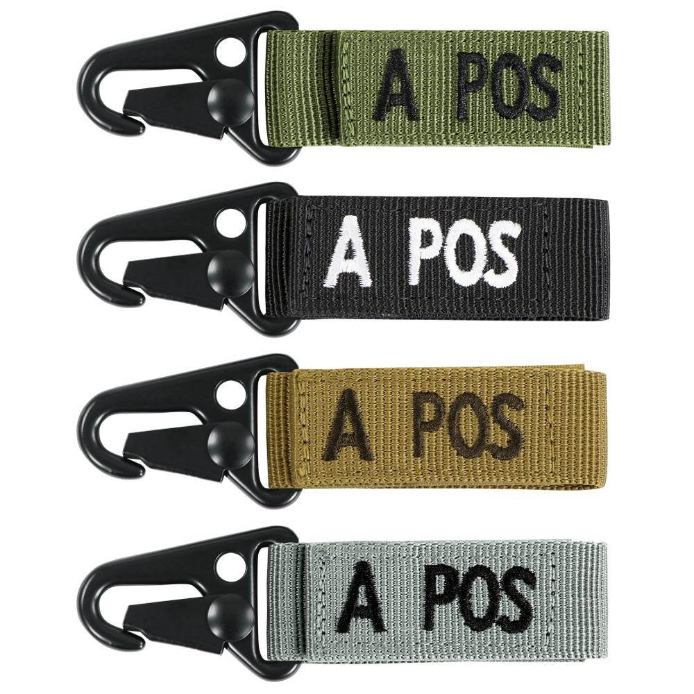 The Condor Blood Type Key Chain set includes four keychains with black metal clips and fabric straps in green, black, brown, and gray, each featuring “A POS” embroidered text.