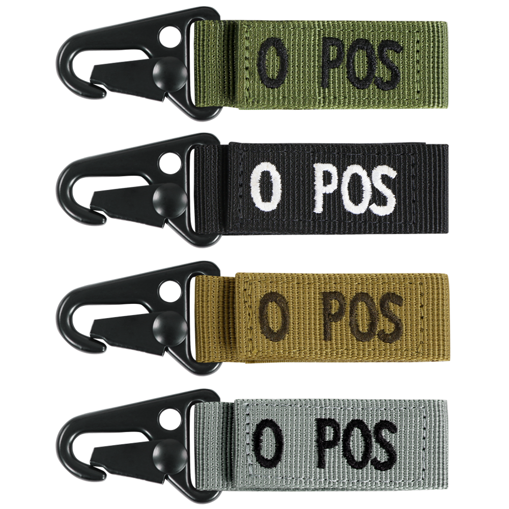 The Condor Blood Type Key Chain set includes four fabric keychains with black metal clips, labeled O POS in white or black, and comes in green, black, tan, and gray.