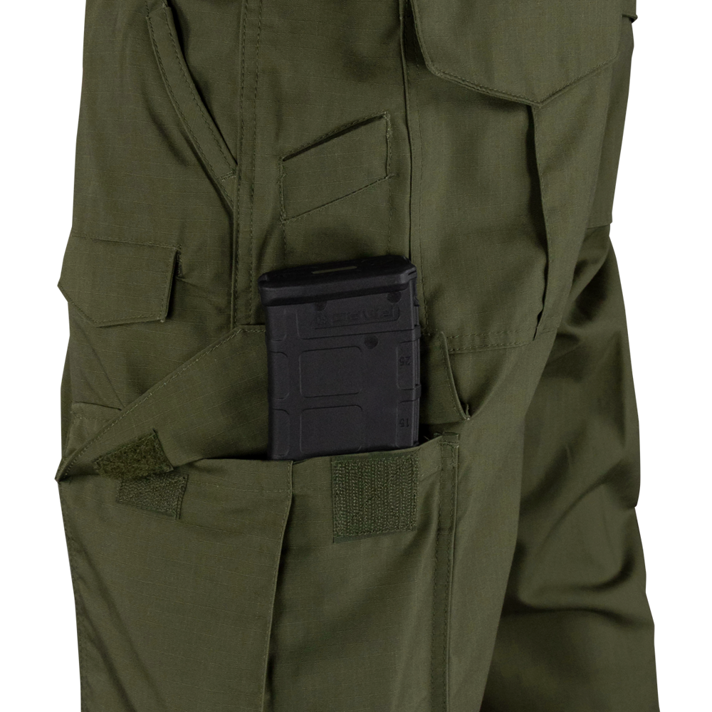 A black rifle magazine is partially inserted into a side pocket of the Condor Sentinel Tactical Pants in green.