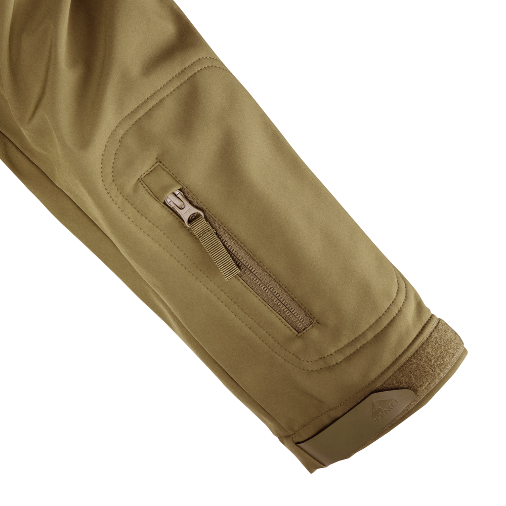 Close-up of the Condor Summit Softshell Jacket sleeve, showing a zippered pocket, stitched seam, and Velcro cuff strap for enhanced warmth and protection in cold weather.