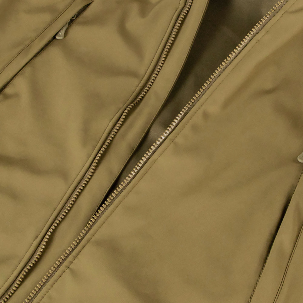 Close-up of the Condor Summit Softshell Jacket in tan, showcasing visible zippers and thermal insulation for enhanced warmth in cold weather.
