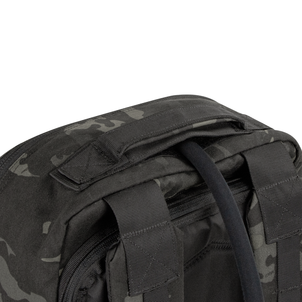 Close-up of the top section of the Condor Prime Pack 21L in MultiCam Black, highlighting its padded carry handle and two adjustable shoulder straps.
