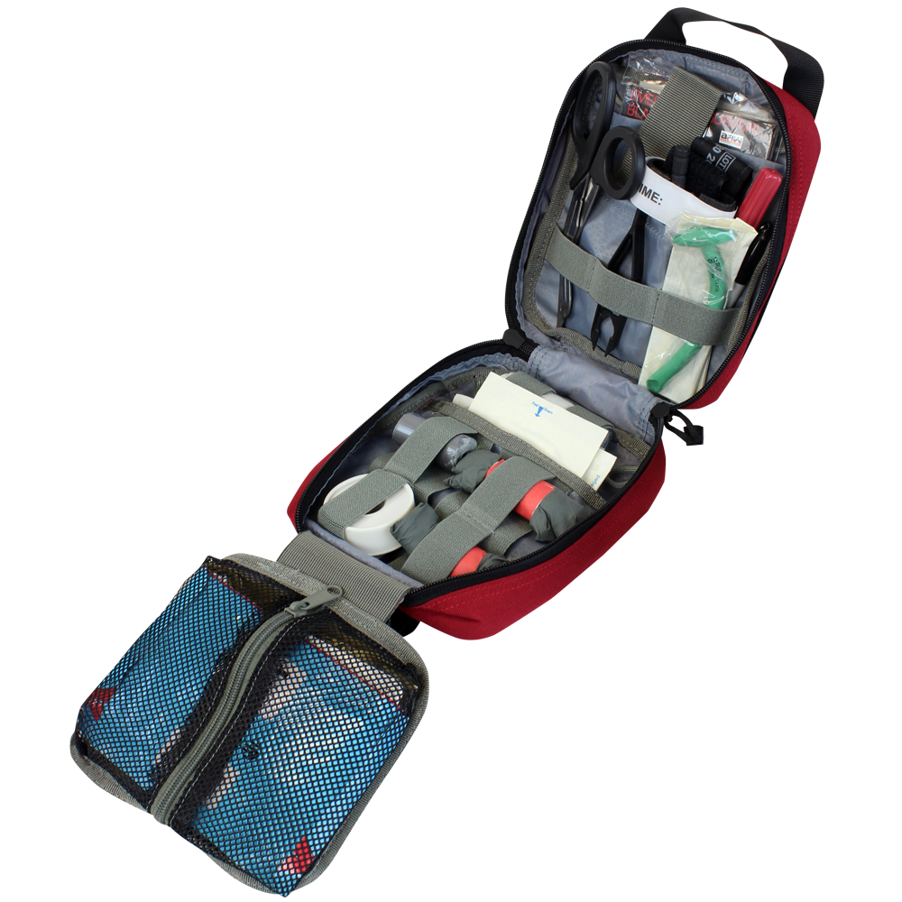 The Condor Rip-Away EMT Pouch displays organized medical supplies—bandages, tape, gauze, scissors, and antiseptic wipes—neatly stored in mesh and elastic compartments.