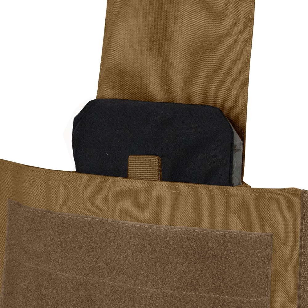 A close-up of a black ballistic plate partially inserted into the front pocket of a Condor Modular Operator Plate Carrier Gen II with a tan Velcro flap.